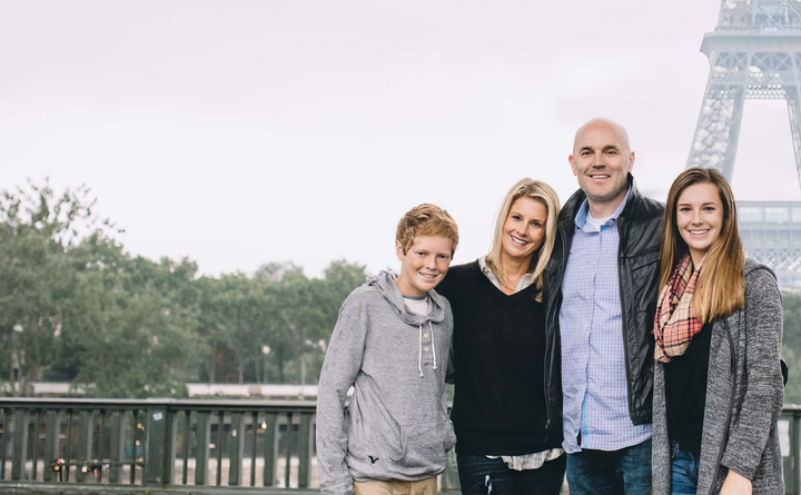 Happy family near Eiffel Tower